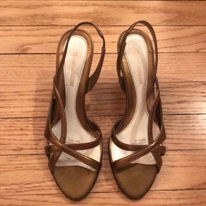 Copper strappy heel.